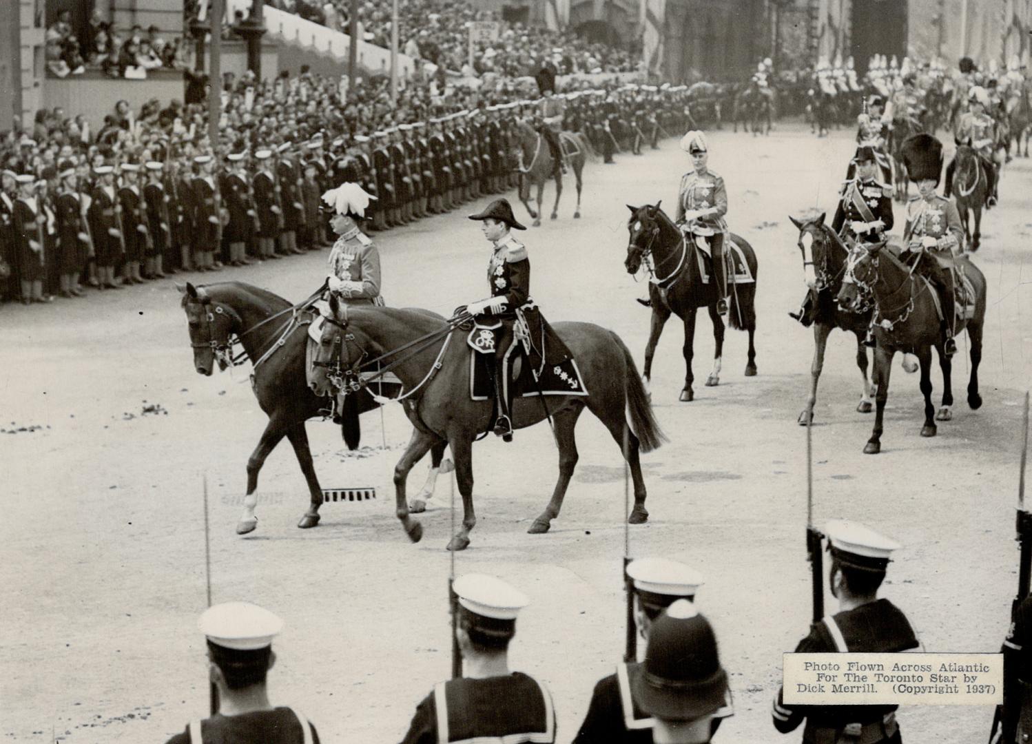 Henry, Duke of Gloucester and George, Duke of Kent, brothers of the King, riding in the procession en route to Westminister Abbey. [Incomplete]