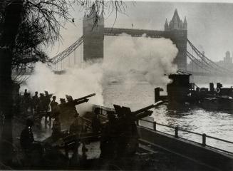 Salute to newborn prince, with London's tower bridge in the background, the honorable artillery company's guns fire a salute of 41 guns, Nov. 15