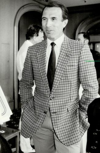 Mark Phillips: Princess Anne's husband is natty in a Daks houndstooth sports jacket at a press reception held by the British menswear manufacturers and retailers