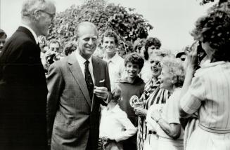 Island hopping: Prince Philip strolls among admirers during his visit to the Royal Canadian Yacht Club's retreat on Toronto Island