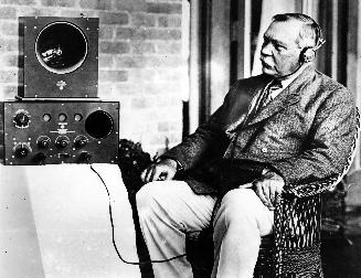 Arthur Conan Doyle listening to radio