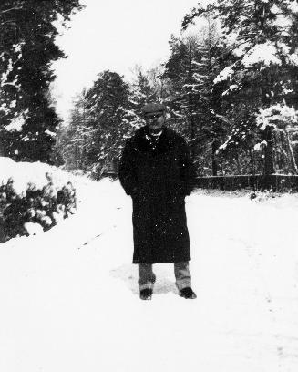 Arthur Conan Doyle standing in the snow