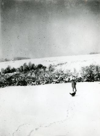Arthur Conan Doyle with a dog in the snow