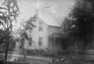 Image shows a limited view of a two storey house.
