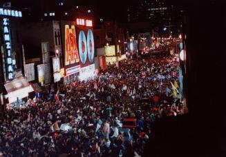 Street Party: Yonge Street was awash with jubilant fans, left who partied well into the wee hours yesterday