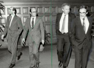 Monte Kwinter, Ontario's minister for consumer and commercial relations, at left, is looking at Nader Ghermezian, one of four brothers who built the West Edmonton Mall