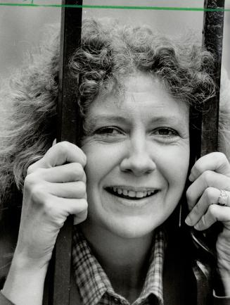 Why the bars? Frankly, we don't know why the photographer put Martha Gibson behind them