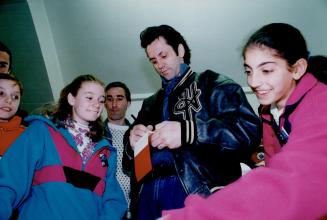 Meanwhile, Doug Gilmour, inset, signs autographs for adoring fans