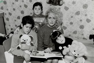 Family Tragedy: Ann Giordano and children Michael, 10, and twins Anthony and Janine, 5 1/2, mourn her late husband Antonio, shown above with Michael at 4 1/2 years