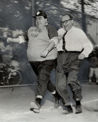 Mayor Philip Givens runs the bases with Controller Joseph Piccininni