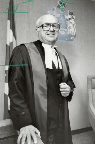 His honor: Eight years after becoming a judge, former Metro police commission chairman Phil Givens put on his new robes in College Park Provincial Court yesterday