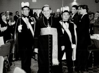 Pictures of Jozef Cadinal Glemp of Poland entering church hall for dinner accompanied by honor guard of Knights of Columbus, John Kostek and Larry Dlugosz