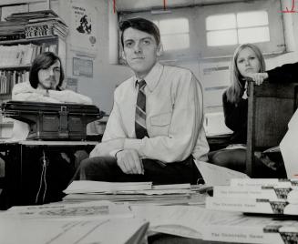 The Staff: Founder Dave Godfrey (foreground), Douglas Fetherling (left), Norma Sherk, secretary (right)