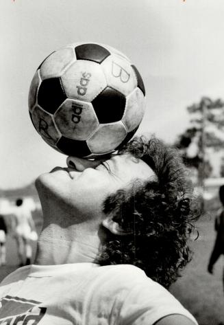 Heads up, Godfrey. Metro Chairman Paul Godfrey got a very close look at what soccer's all about when he visited the Toronto Blizzard training camp yes(...)