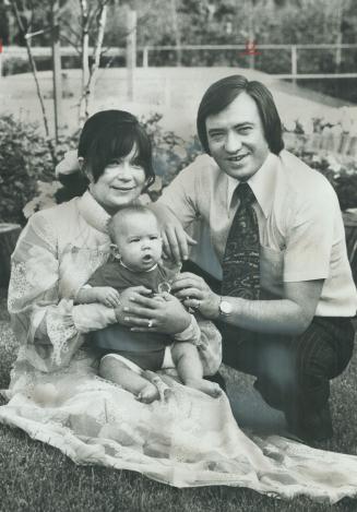 The new metro chairman, Paul Godfrey, and his wife, Gina, play with their 5-month-old son Robin outside their home on Leacock Cres., North York. As ch(...)