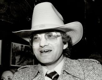 Metro's Urban Cowboy: Metro Chairman Paul Godfrey rode in a stagecoach to officially open Toronto's latest watering hole, called ''Cowboys'' in the Village By the Grange