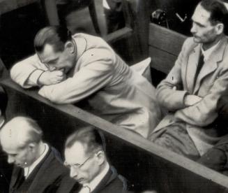 Two moods are displayed by Hermann Gering as he listens to the evidence