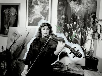 Rivka Golani plays the viola in front of her paintings which cover every inch of wall space in the living room of her north Toronto home. Born in Isra(...)