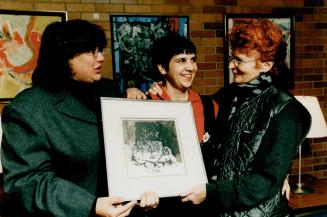 Prize winner: Betty Goodwin, right, receives one of Harold Town's works, and a cheque for $25,000, from Town's daughters Shelley, left and Heather