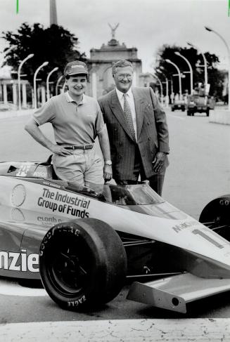 Driver and Boss: Scott Goodyear poses with James O'Donnell of Mackenzie Financial at the start-finish line of July 22 Molson Indy at Exhibition Place
