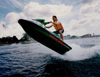 IndyCar racer Scott Goodyear shows his prowess on water yesterday as he manoeuvres on a jet ski at Ontario Place