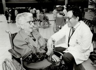 Health guarantee: Dr. Michael Gordon, author of a medical guide for seniors, chats with former patient Olga Tamas, 86, at Baycrest Hospital. Gordon ad(...)