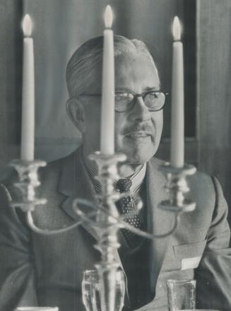 Framed by candelabra, Walter Gordon, President of the Privy Council of Canada, delivered in Toronto Saturday the speech that sparked hot debate in Ott(...)