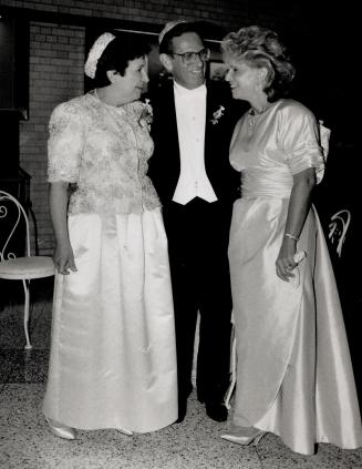 Goldie Weatherhead, the bride's mother, below left, with Senator and Carole Grafstein