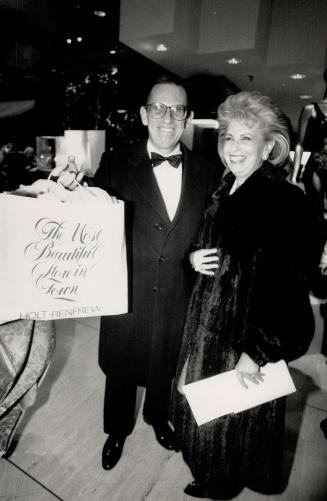 Happy customer: Right, Senator Jerry Grafstein, with wife Carole, holds a bag of Holt Renfrew Sea Island cotton shirts