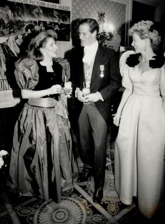 Above, left to right, Anne-Marie Applin in a Winston gown, with Bill Graham (wearing his own Legion of Honor Medal) and Catherine Graham in Nina Ricci