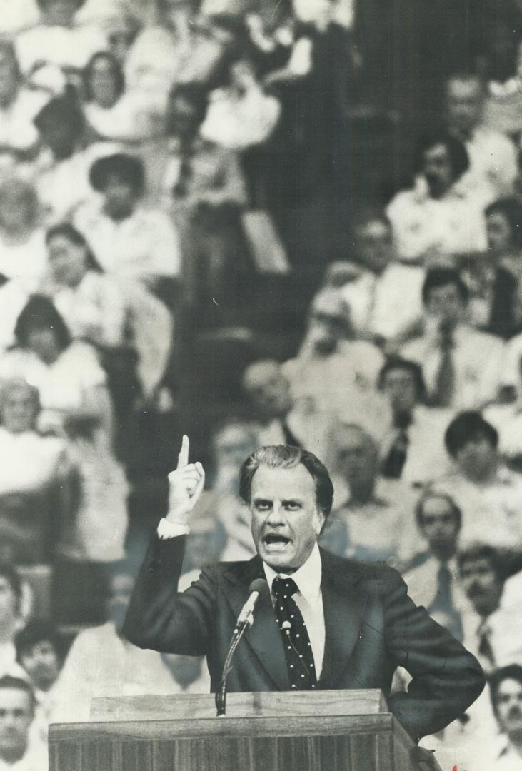 Reader charges that criticism of evangelist Billy Graham, above, during Toronto crusade, is ''a case of clerical jealousy.'' Another reader says that Graham is ''in the company of the Apostles.''