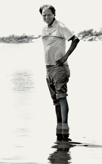 Evangelist Billy Graham paddles in Lake Ontario