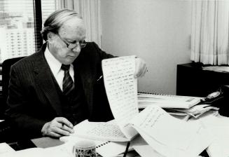 Final judgement: Mr. Justice Samuel Grange, seen here reviewing his notes last month, has completed his report on the mysterious deaths of 36 babies a(...)