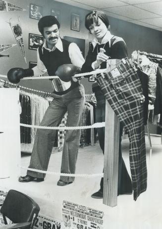 No punching in this ring. Clyde Gray (left), the 26-year-old Canadian and Commonwealth welterweight boxing champion, and his wife, Evelyn, look over f(...)
