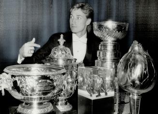 Wayne Gretzky poses with some of the hardware he picked up at last night's NHL awards ceremony