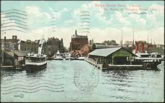 Image shows a few boats at the docks.
