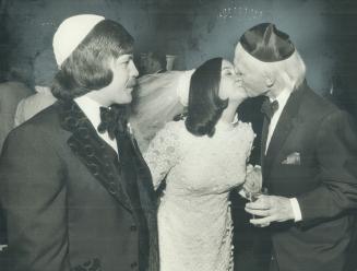 Kiss for the bride from Lt.-Gov. Ross Macdonald at the wedding of Susan Joy Grossman, daughter of provincial Revenue Minister Allan Grossman, and rese(...)