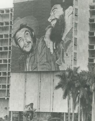 Posters of slain revolutionary hero Ernesto (Che) Guevara, left, are everywhere in Cuba