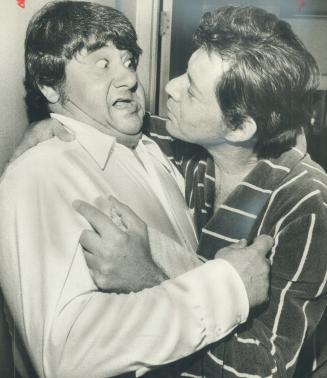 Those showbiz people are always clowning around, or so it would seem from the antics of comedian Buddy Hackett (left) and singer Eddie Fisher in front(...)