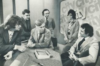 Changes in City-TV format are discussed by executive editor Ron Haggart (centre) with Bob Cezar, engineering, Jim West, sales, David Ruskin, station m(...)