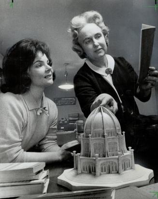 Pop singer Joyce Hahn with Mrs. Audrey Westheiser of Baha'i Spiritual Assembly, who points to model of Baha'i temple at Wilmette, Ill. Joyce says she's ''learning to really pray'' with Baha'i