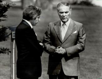 Quiet chat: Alexander Haig, U.S. secretary of state, seems to wring his hands as he talks to External Affairs Minister Mark MacGuigan. Haig came as an adviser to President Ronald Reagan