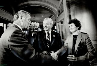 Haig and host: Former U.S. secretary of state Alexander Haig greets Premier William Davis and his wife, Kathleen, before a luncheon meeting yesterday (...)