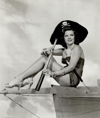 On the upper right, Aileen Haley, one of MGM's Ziegfeld girls, plays a gay, bold pirate