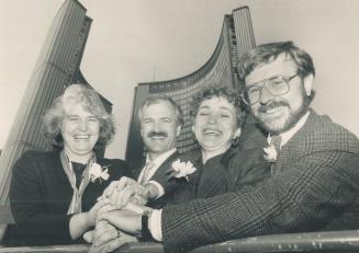 Happy crew. New democrafts, left to right, Barbara Hall, Jack Layton, Marilyn Churley and Rob Maxwell smile happily in front of Toronto City Hall, where they'll join a new council