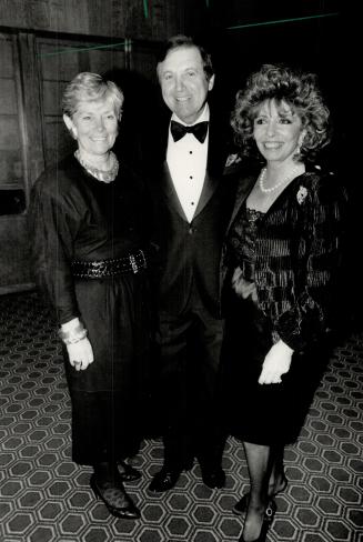 Above, Monty Hall, chairman of Variety Clubs International, hugs sister-in-law Edith, left, and artist Rita Cohen, who wore a black Krizia to the gala