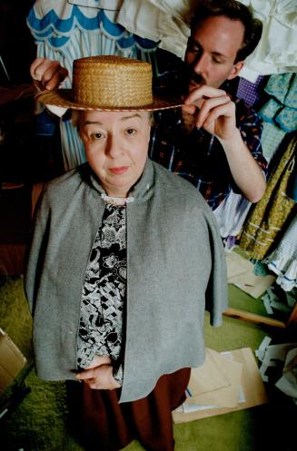 Barbara Hamilton is fitted for costumes for the Eigin Theatre production of Anne