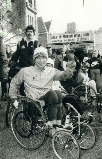 Wheelchair hero Rick Hansen waves goodbye at Queen's Park after his triumphant 10-day visit to Metro
