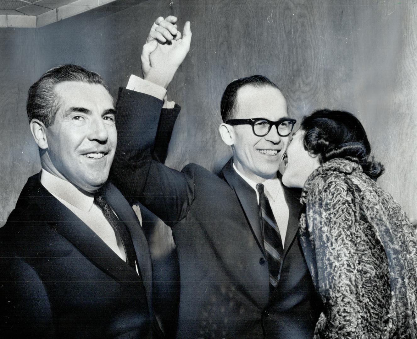 Congratulations for Progressive-Conservative winner in Beaches, Jack Harris: Controller Don Summerville raises his arms while his wife, Mary, plants a kiss on his cheek