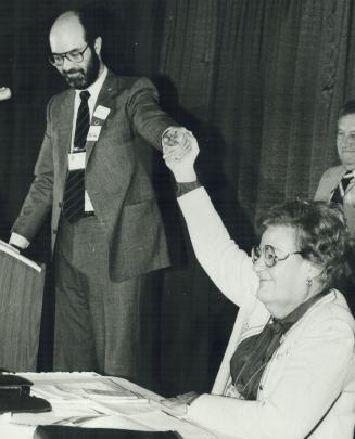 Victory: New CUPE president Jeff Rose's pronouncement is acknowledged by outgoing president Grace Hartman following Rose's upset victory yesterday